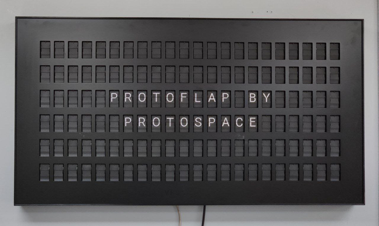 a split flap display with the words "PROTOFLAP BY PROTOSPACE"